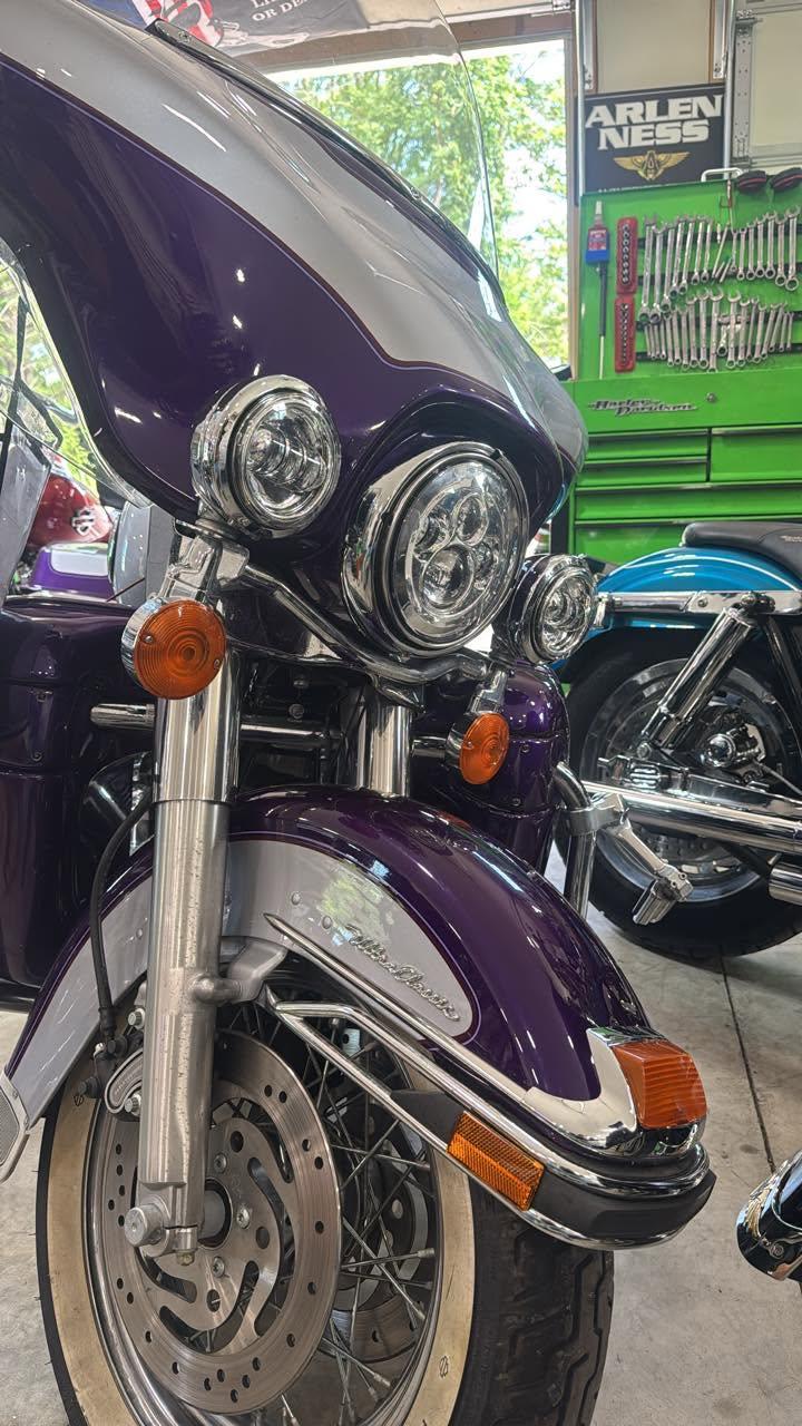 Close-up of a custom purple Harley Ultra Classic serviced at BlueLine Cycles