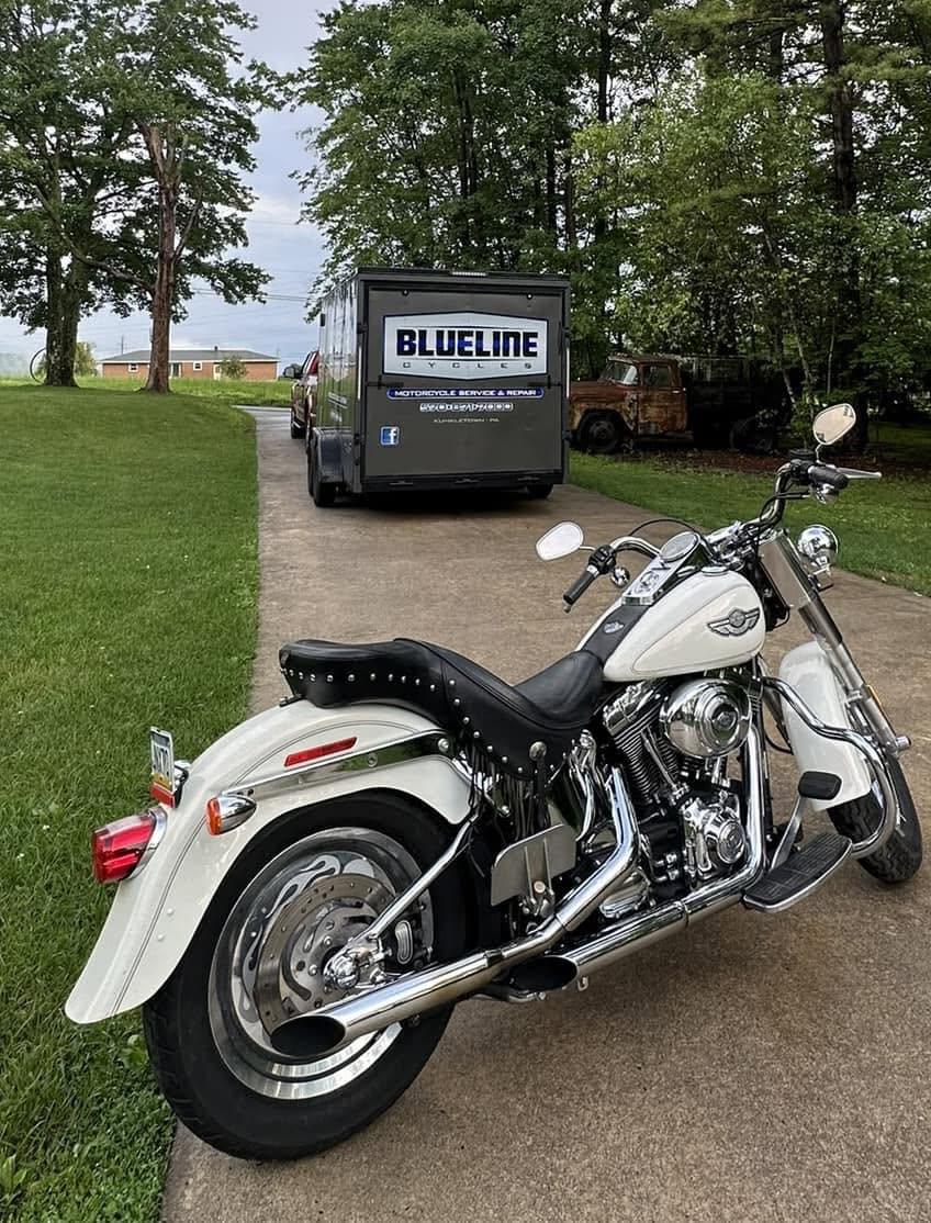 BlueLine Cycles service trailer with a customer's Harley Softail ready for pickup